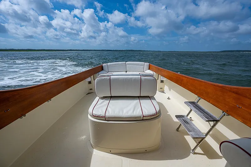 Slide: The Image of Hinckley Picnic Boat 36 Classic, 1996, cruising on open water under a partly cloudy sky. - 7