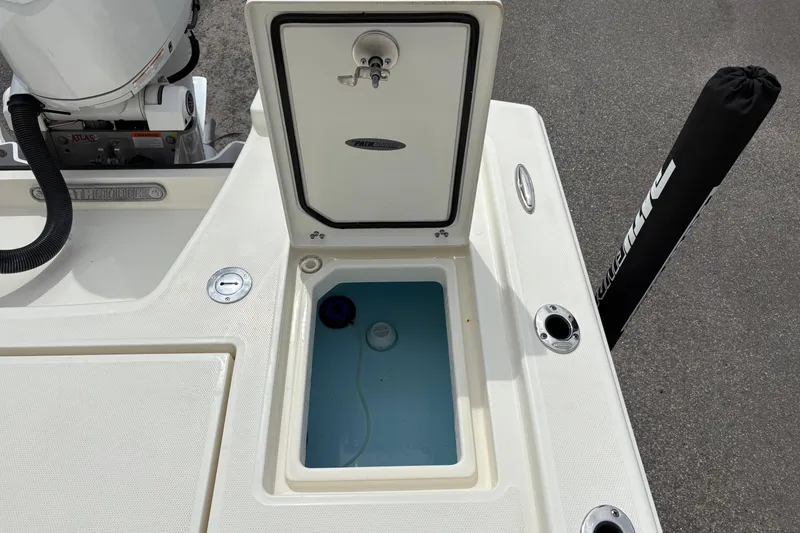 Slide: The Image of Open storage compartment on a 2025 Pathfinder 2200 TRS boat deck. - 11