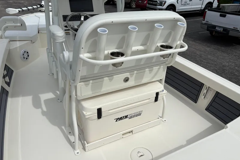 Slide: The Image of 2025 Pathfinder 2200 TRS boat interior with rod holders and Engel cooler. - 17
