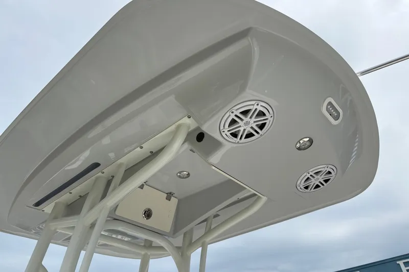 Slide: The Image of T-top of 2025 Pathfinder 2200 TRS boat with speakers and lights. - 23