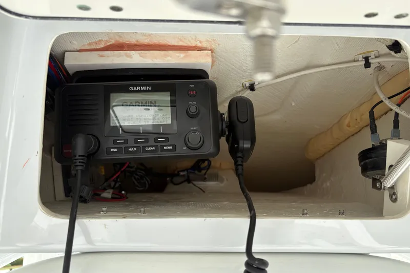 Slide: The Image of Garmin marine radio installed in 2025 Pathfinder 2200 TRS boat console. - 24