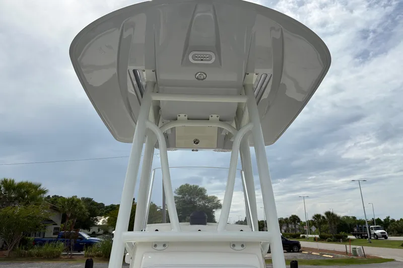 Slide: The Image of 2025 Pathfinder 2200 TRS boat T-top against cloudy sky backdrop. - 27