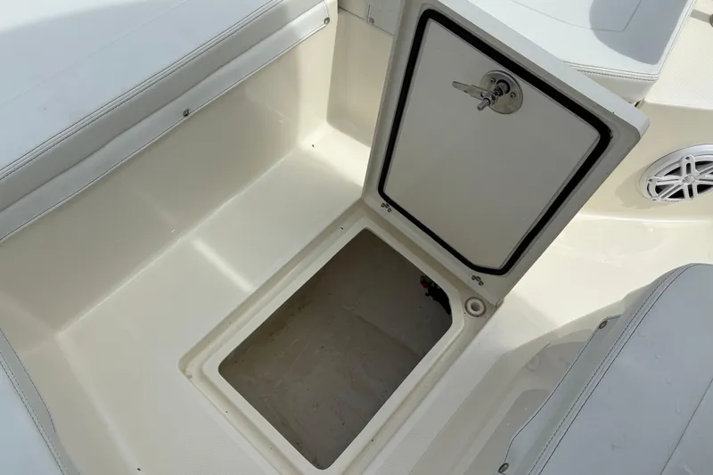 Slide: The Image of Open storage compartment on 2025 Pathfinder 2200 TRS boat deck. - 30