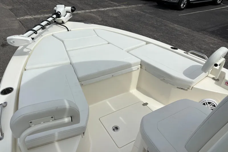 Slide: The Image of 2025 Pathfinder 2200 TRS boat interior with cushioned seating and trolling motor. - 31