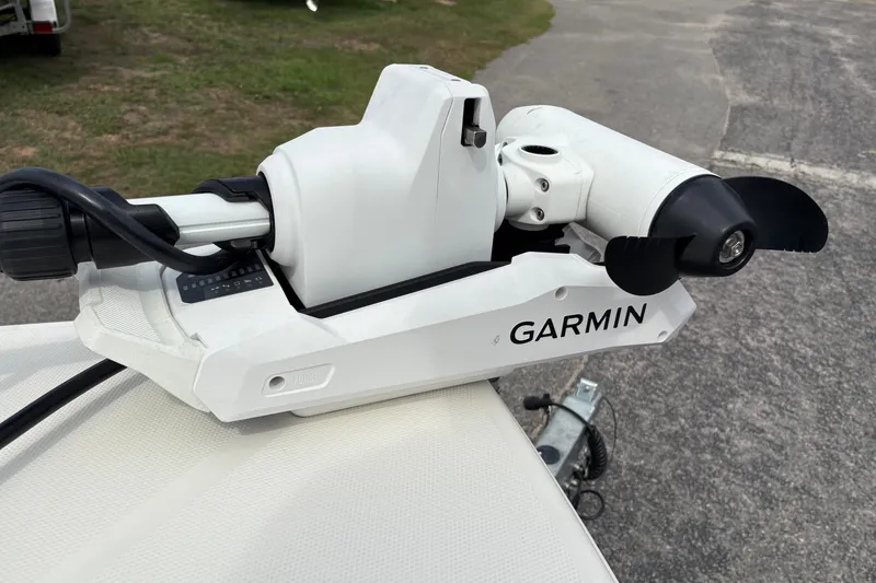 Slide: The Image of Garmin trolling motor on 2025 Pathfinder 2200 TRS boat, parked on pavement. - 33