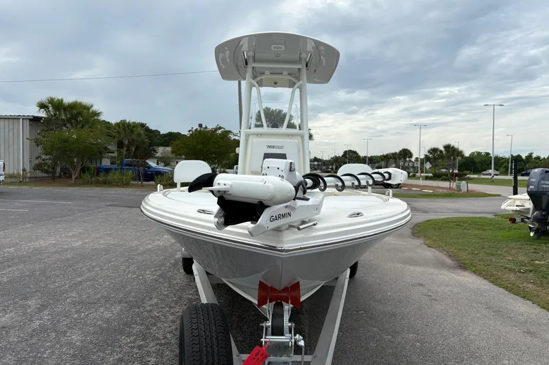 Slide: The Image of 2025 Pathfinder 2200 TRS boat on trailer, featuring Garmin equipment, parked outdoors. - 7
