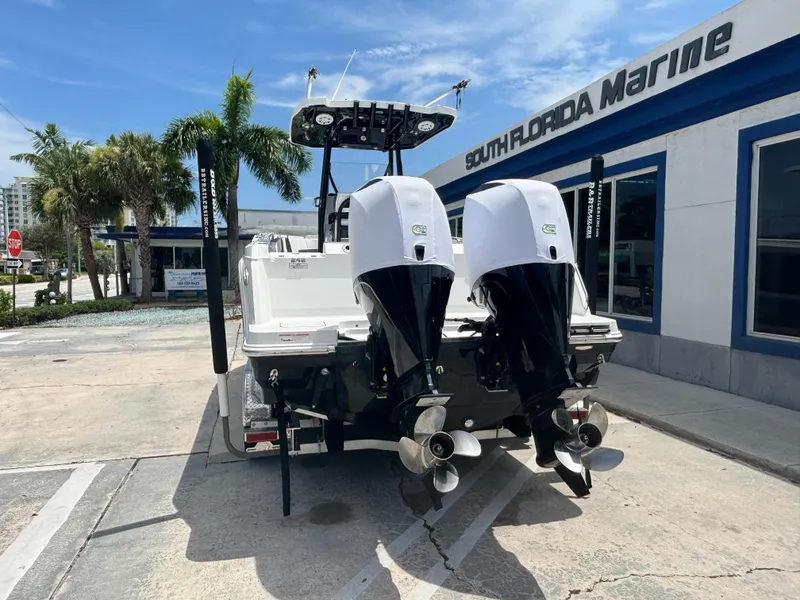 Slide: The Image of 2019 Blackfin 242 CC boat with dual engines at South Florida Marine dealership. - 1