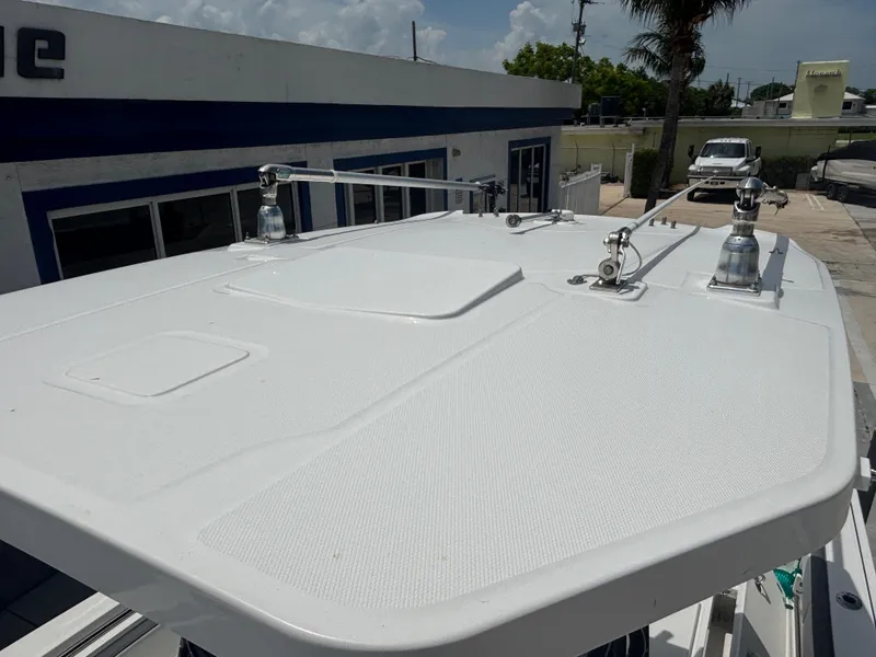 Slide: The Image of 2019 Blackfin 242 CC boat roof with mounted equipment, outdoor setting. - 14