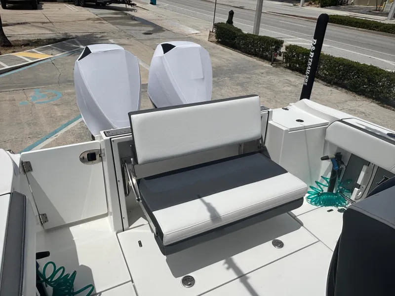 Slide: The Image of 2019 Blackfin 242 CC boat with dual engines and foldable seating. - 3