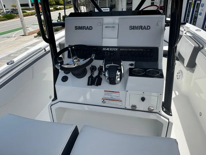 Slide: The Image of 2019 Blackfin 242 CC boat console with Simrad electronics and Mercury controls. - 6
