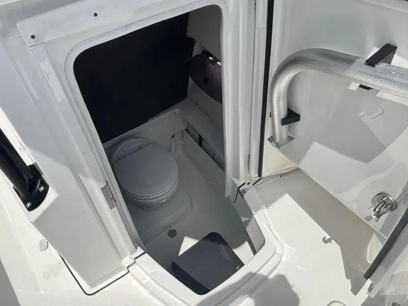 Slide: The Image of 2019 Blackfin 242 CC boat interior with compact marine toilet. - 9