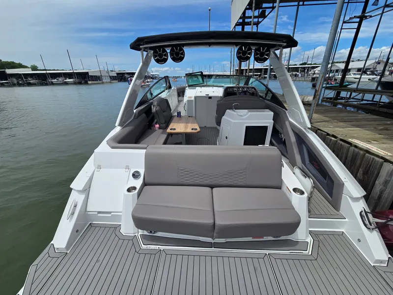 Slide: The Image of 2021 Cruisers Yachts 338 on water, modern design. - 13