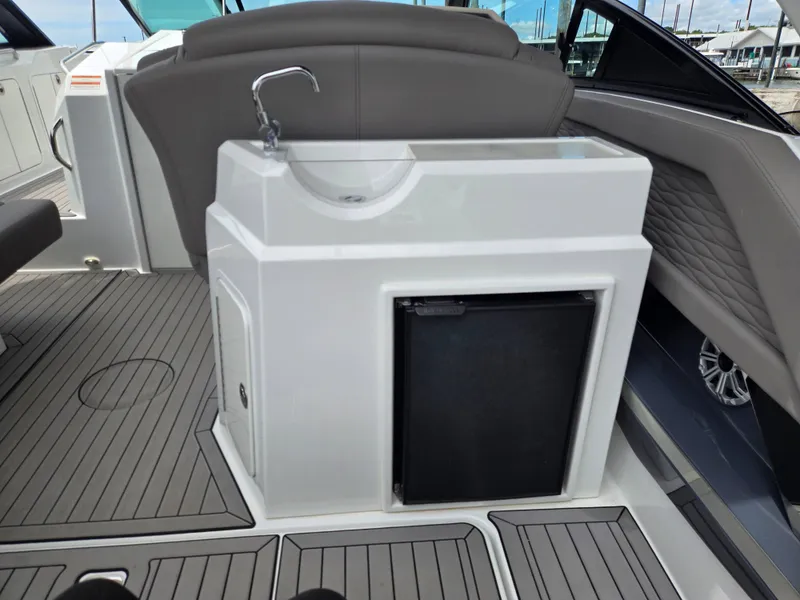 Slide: The Image of Interior of 2021 Cruisers Yachts 338 with sink and fridge. - 17