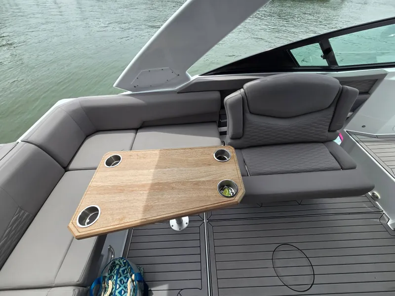 Slide: The Image of Interior of a 2021 Cruisers Yachts 338 with wooden table. - 20