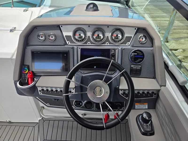 Slide: The Image of 2021 Cruisers Yachts 338 dashboard with modern instruments. - 22