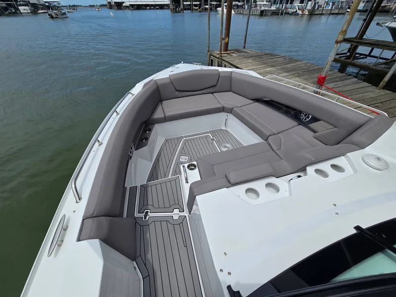Slide: The Image of Luxurious seating area on a 2021 Cruisers Yachts 338 boat. - 24