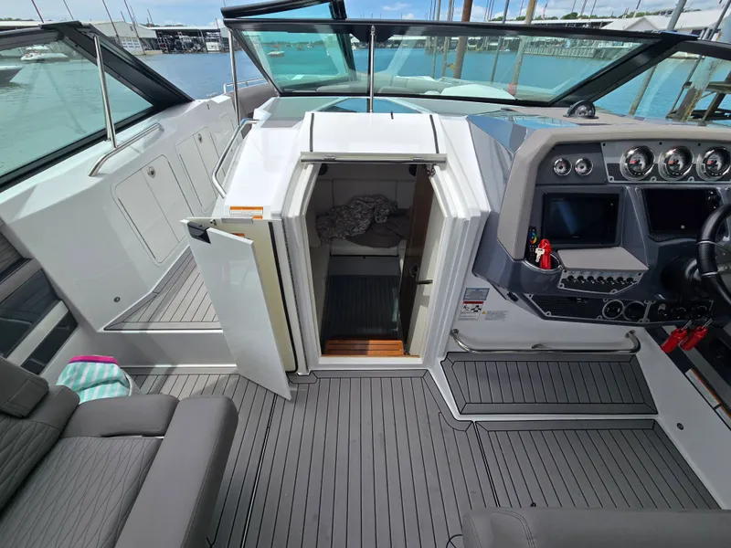 Slide: The Image of Interior of a 2021 Cruisers Yachts 338 with cockpit and cabin. - 26