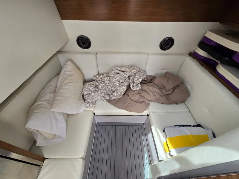 Slide: The Image of Interior of 2021 Cruisers Yachts 338 with cushions and blankets. - 28