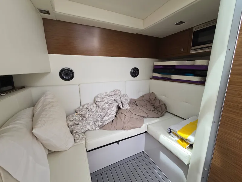 Slide: The Image of Interior of a 2021 Cruisers Yachts 338, cozy cabin space. - 29