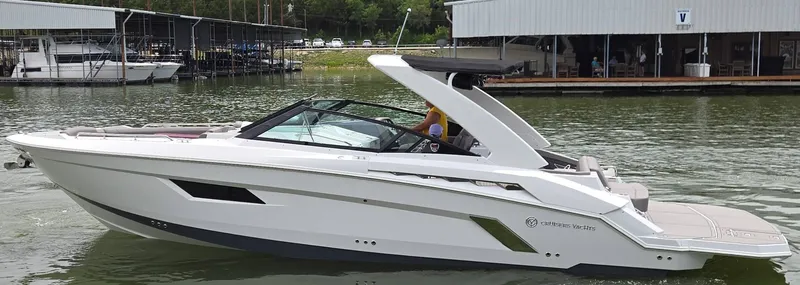 Slide: The Image of 2021 Cruisers Yachts 338 on a calm lake. - 3