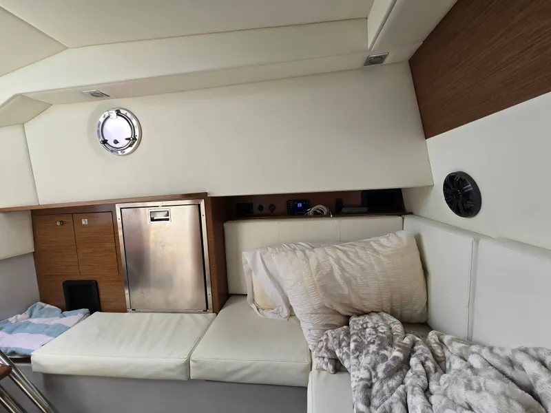 Slide: The Image of Interior of 2021 Cruisers Yachts 338 with cozy seating area. - 31