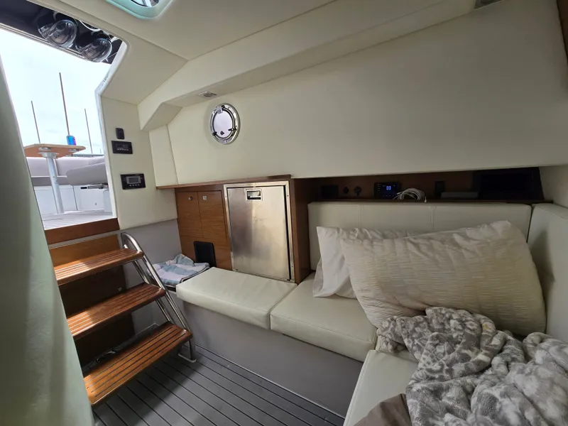 Slide: The Image of Interior of 2021 Cruisers Yachts 338 with seating and fridge. - 32