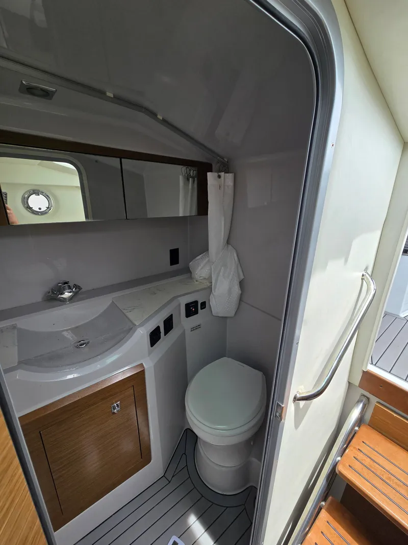 Slide: The Image of Interior view of 2021 Cruisers Yachts 338 bathroom. - 35