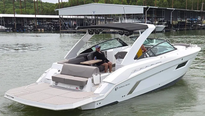 Slide: The Image of 2021 Cruisers Yachts 338 on calm water, modern design. - 6