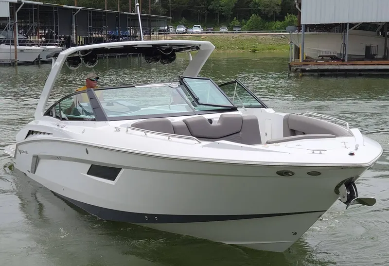 Slide: The Image of 2021 Cruisers Yachts 338 on a calm lake. - 7