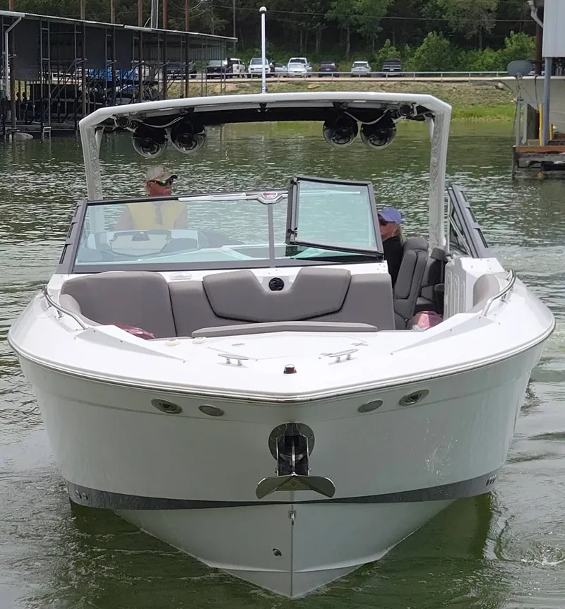 Slide: The Image of 2021 Cruisers Yachts 338 on a calm lake. - 8