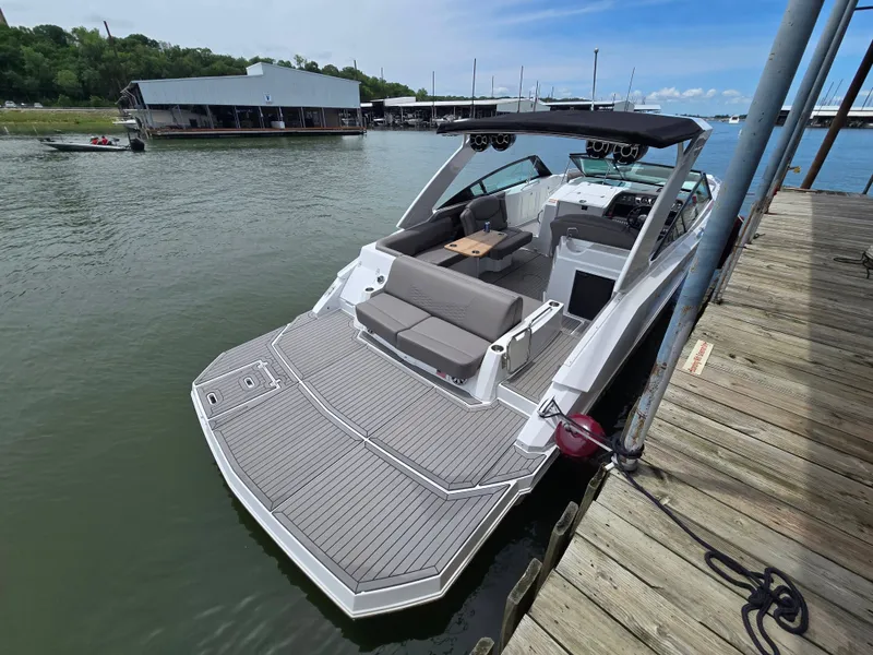 Slide: The Image of 2021 Cruisers Yachts 338 at dock, modern design. - 9