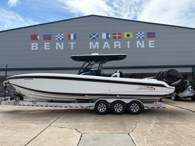 The Image of 2015 Nor-Tech 340 Sport boat in front of Bent Marine building. - 1