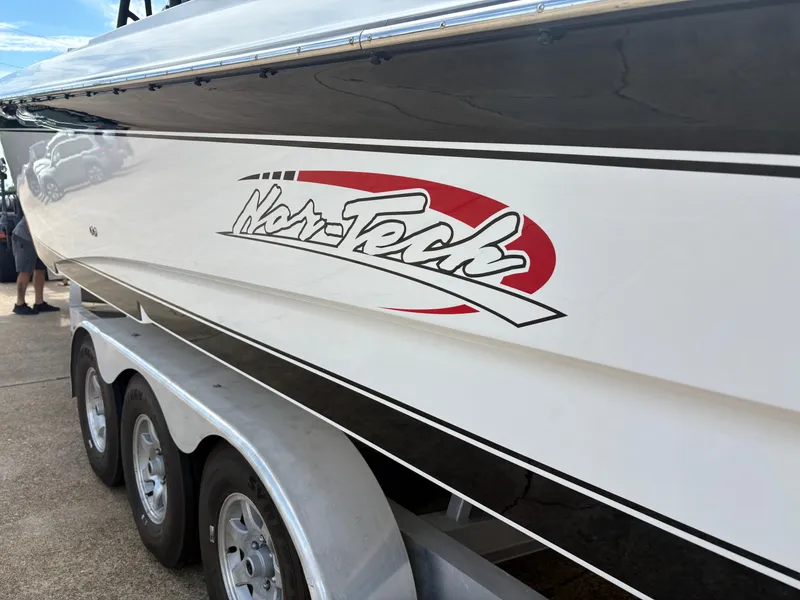 Slide: The Image of 2015 Nor-Tech 340 Sport boat on trailer, side view. - 12
