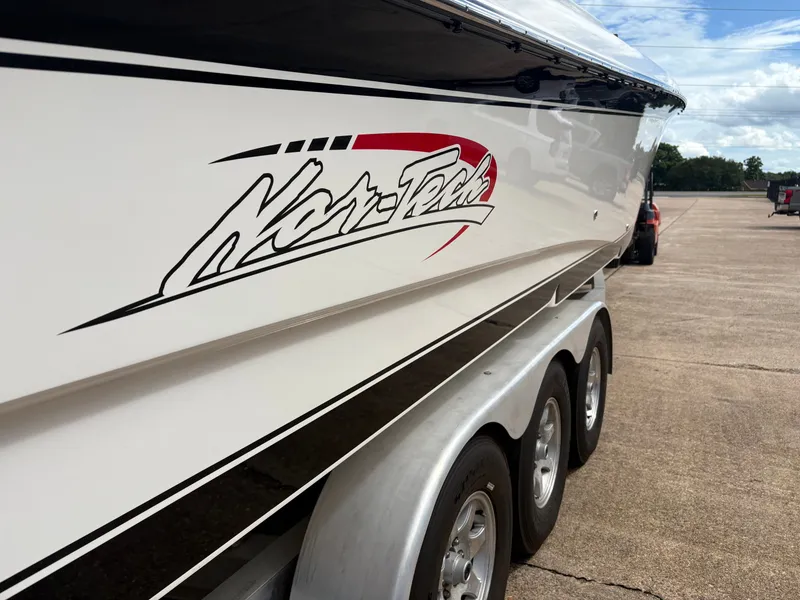 Slide: The Image of 2015 Nor-Tech 340 Sport boat on trailer, side view. - 13