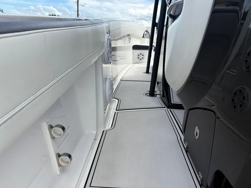 Slide: The Image of Interior of a 2015 Nor-Tech 340 Sport boat, white and black details. - 8