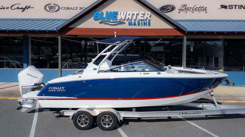 The Image of 2026 Cobalt R6 boat in front of Bluewater Marine store. - 1