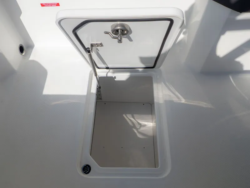 Slide: The Image of Open storage hatch on a 2026 Cobalt R6 boat. - 13