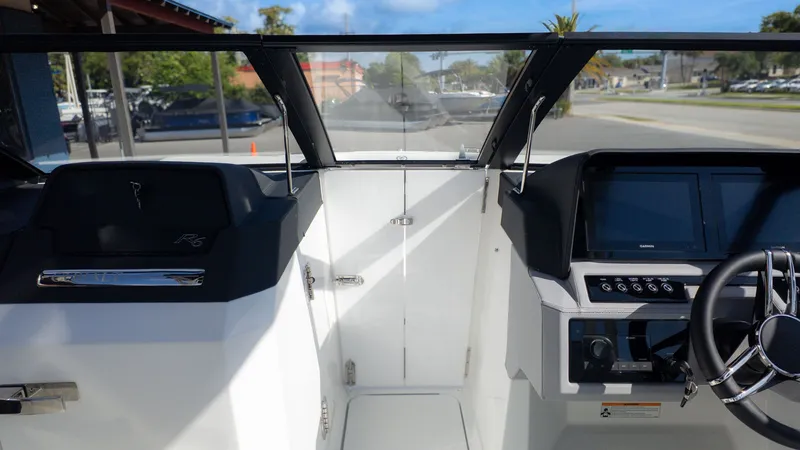 Slide: The Image of Interior view of 2026 Cobalt R6 boat with modern helm console. - 29