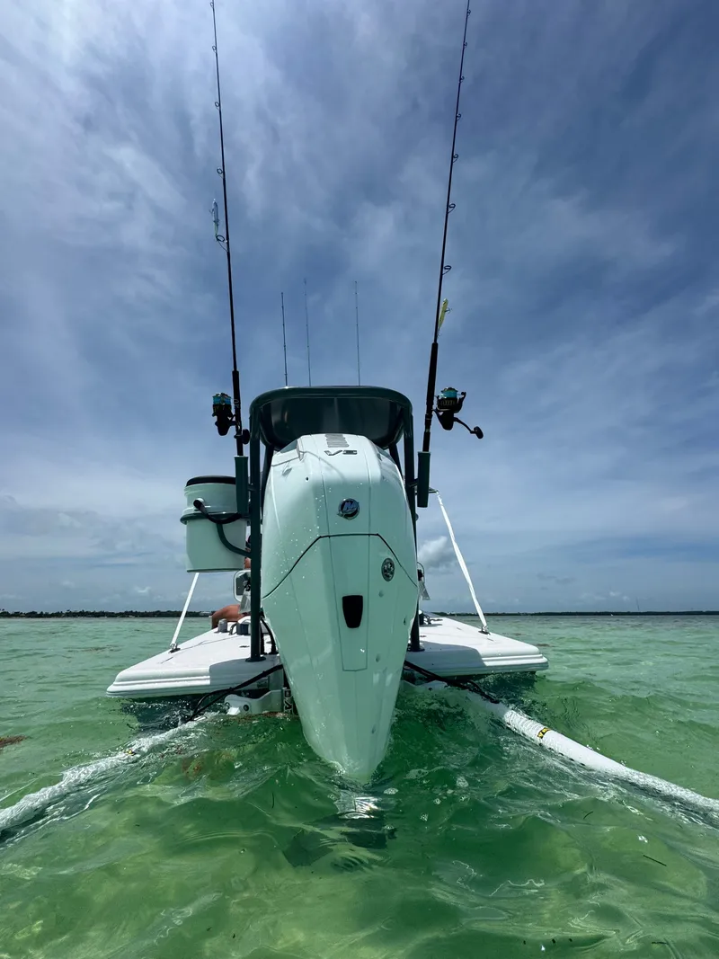 Slide: The Image of Vtech 18' Flats boat 2027 in clear water with fishing rods. - 10