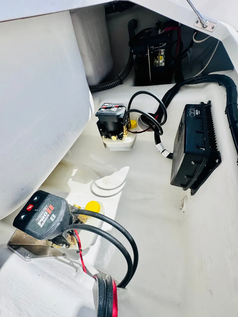 Slide: The Image of Interior view of Vtech 18' Flats boat, showing electronics and wiring. - 15