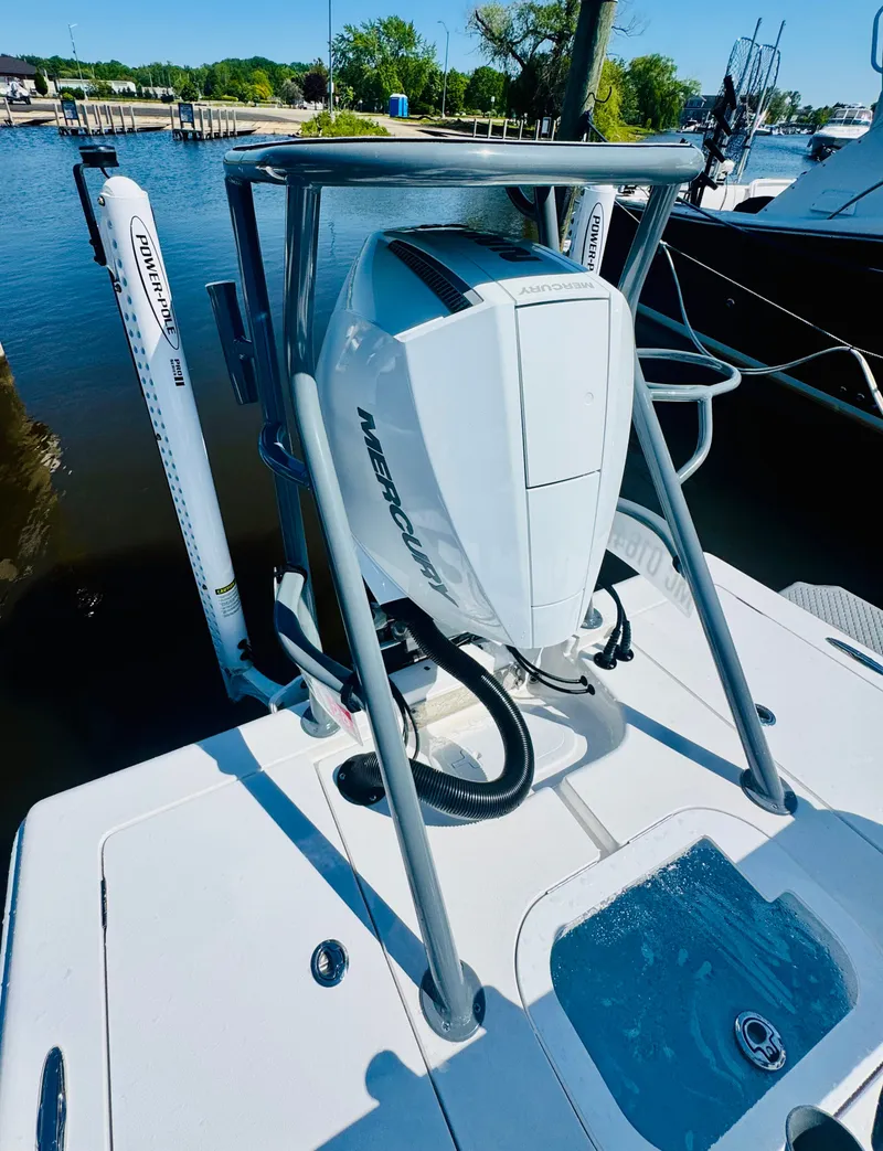 Slide: The Image of Vtech 18' Flats 2027 boat with Mercury outboard motor at dock. - 19