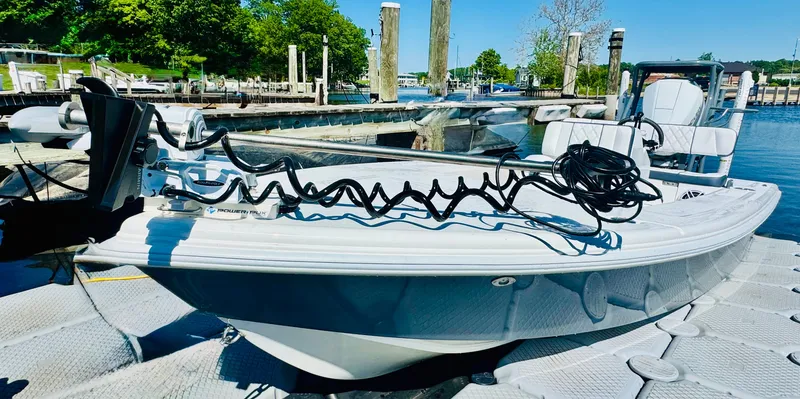 Slide: The Image of Vtech 18' Flats boat at dock, 2027 model. - 2