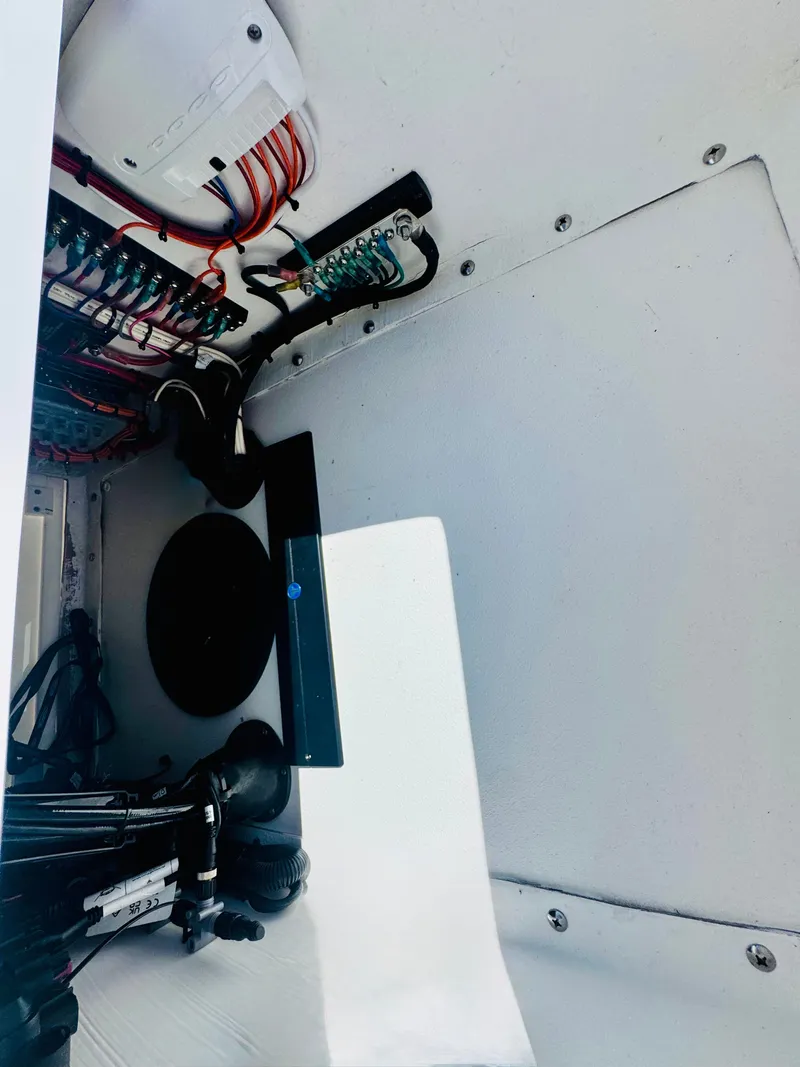 Slide: The Image of Interior view of Vtech 18' Flats boat, wiring visible. - 21
