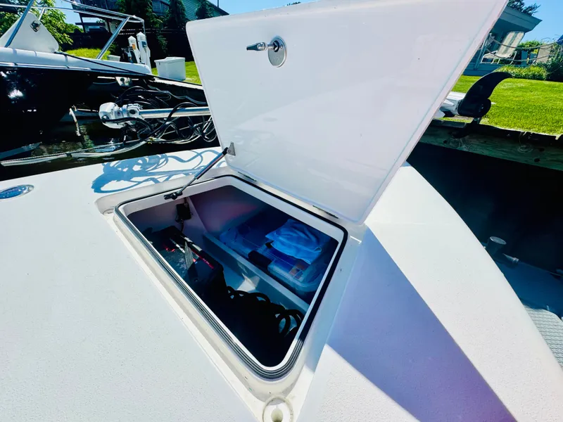 Slide: The Image of Vtech 18' Flats 2027 boat with open storage compartment. - 25