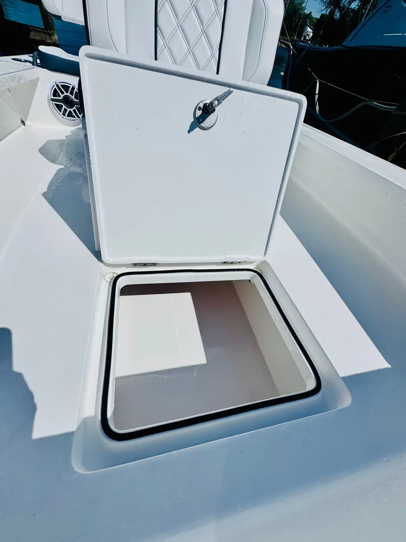 Slide: The Image of Vtech 18' Flats 2027 boat with open storage compartment. - 27