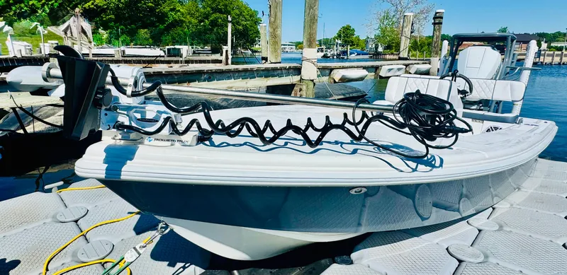 Slide: The Image of Vtech 18' Flats boat at dock, 2027 model. - 30
