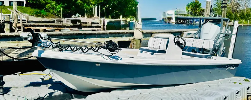 Slide: The Image of Vtech 18' Flats boat at dock, 2027 model. - 37
