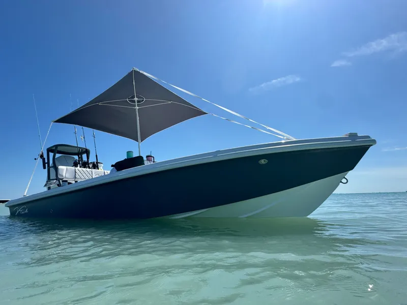 Slide: The Image of Vtech 18' Flats boat 2027 in clear water with sunshade. - 7