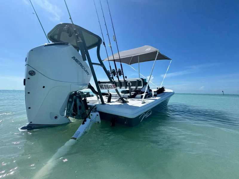 Slide: The Image of Vtech 18' Flats boat 2027 in clear water with blue sky. - 8