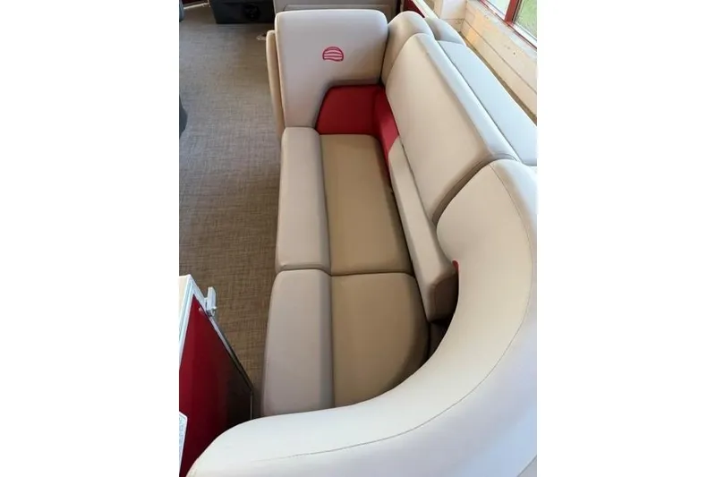 Slide: The Image of 2026 Sun Tracker Party Barge 20 DLX interior seating with beige and red upholstery. - 7